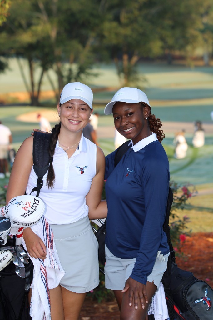 Two HBCU women golfers posing together